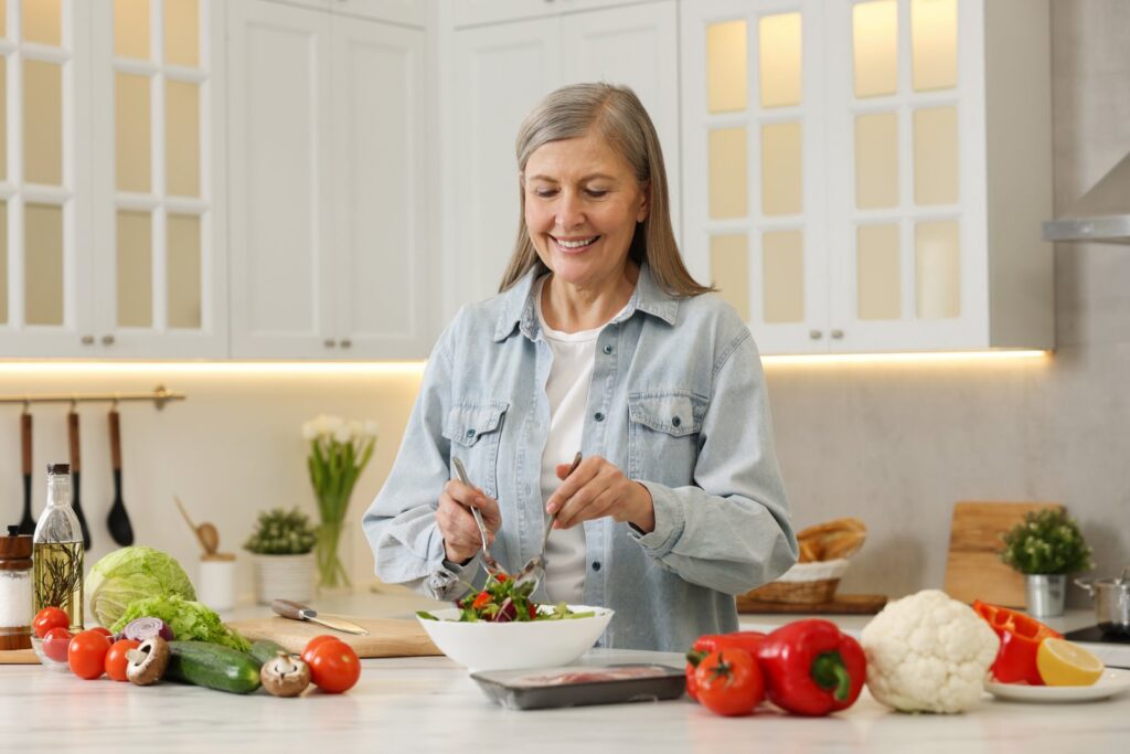 woman prepares nutritious salad in a bright kitche 2026 09 25 03 38 47 utc